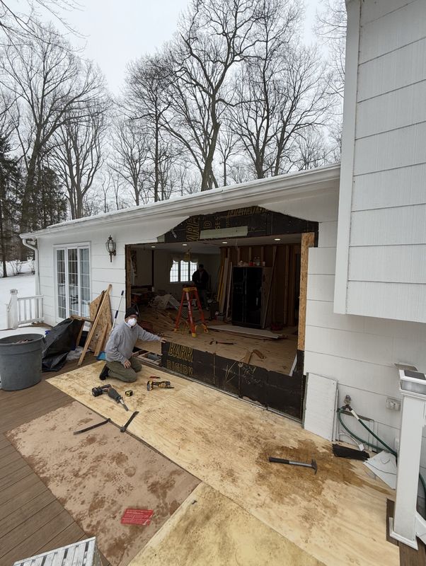 During: the opened back wall seen from the deck, in the snow