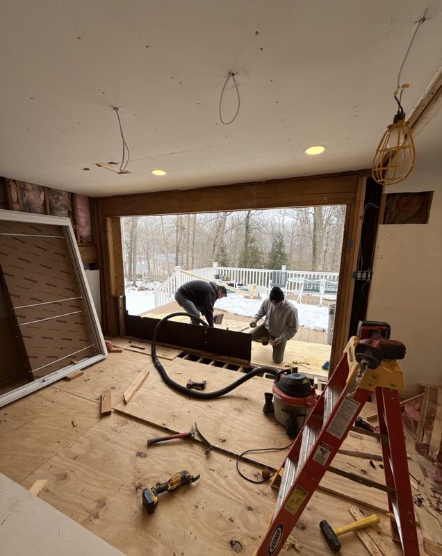 During: the back wall fully opened up, crew at work